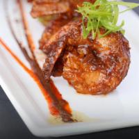 Chilli Shrimp · This most popular Indo-Chinese spicy food is marinated with spices, deep fried and cooked on...