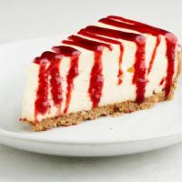 Cheesecake · garnished with a raspberry sauce