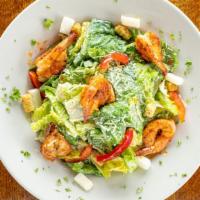 Caesar Salad · Crisp romaine, red bell pepper, jicama, tomato wedges, croutons, and Parmesan cheese, tossed...