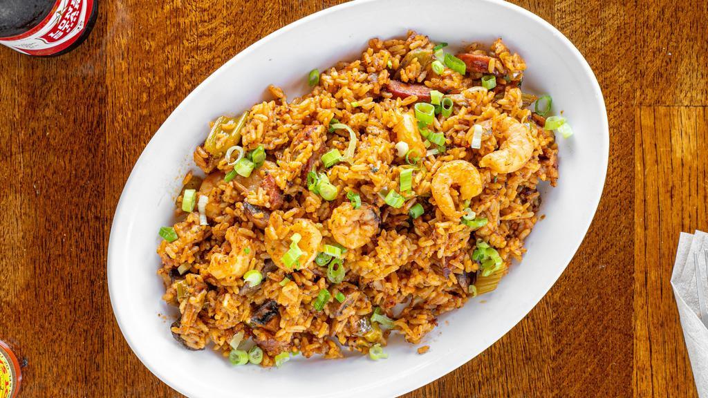 Jambalaya (Small) · Cajun rice with sausage, shrimp, celery, bell peppers, white onions and topped with green onions.
