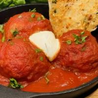 Spanish Meatballs · Veal, pork, ground chicken, Latino spice herb mixture, whipped ricotta, tomato sauce.