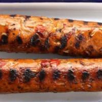 Smoked Sausage On Stick (2) · two beef smoked sausages on stick with spicy and sweet tiger sauce