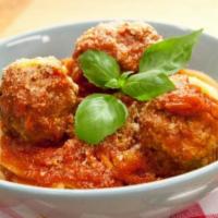 Mama'S Meatballs · Three meatballs baked in the oven with zesty tomato sauce.