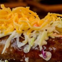 Dixie Dog · Our BBQ sausage on a hotdog bun with cheese, coleslaw, and pickles on top. Onions on the side.