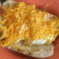 Loaded Potato (Meatless) · Idaho baked potatoes topped with butter, sour cream & cheese and onions.