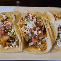 Chicken Taco · Stuffed with taco sauce, lettuce, pico de gallo and queso fresco.