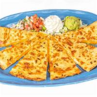 Quesadilla Muy Bueno · Crispy homemade flour tortilla filled with melted Monterey Jack, Cheddar and Mozzarella chee...