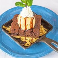 Hot Fudge Brownie · A big warm, moist chocolate brownie topped with vanilla ice cream, hot fudge and whipped cre...
