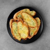 Garlic Bread With Cheese · Italian bread topped with cheese to make a delightful offering.