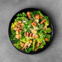 Chicken Caesar Salad · Grilled chicken with crisp, delicious romaine lettuce topped with baked croutons; shaved par...