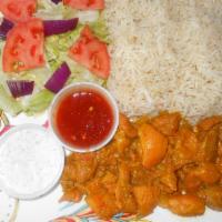 Seasoned Chicken Platter · Seasoned chicken thighs served over white basmati rice and salad
