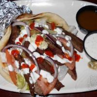 Gyro Sandwich · Served with lettuce, tomato, onions, and white sauce
