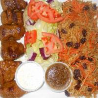 Beef Kabob · Flame broiled Beef tenderloin served over Kabuli Palau rice and salad