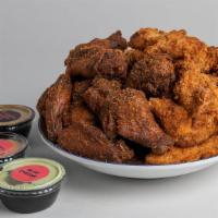 30 Wings Or Tenders With 3 Dipping Sauces · marinated in our signature sweet and spicy dry rub for 24 hours, smoked over hickory wood th...