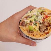 Burrito · Burritos include chips on the side and are served with traditional rice and choice of protei...