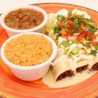 Queso Enchiladas · Three rolled soft flour tortillas with protein, and toppings of your choice.