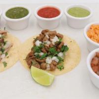 Tacos · Two soft flour, corn or crispy tacos with choice of protein and toppings. Served with a side...
