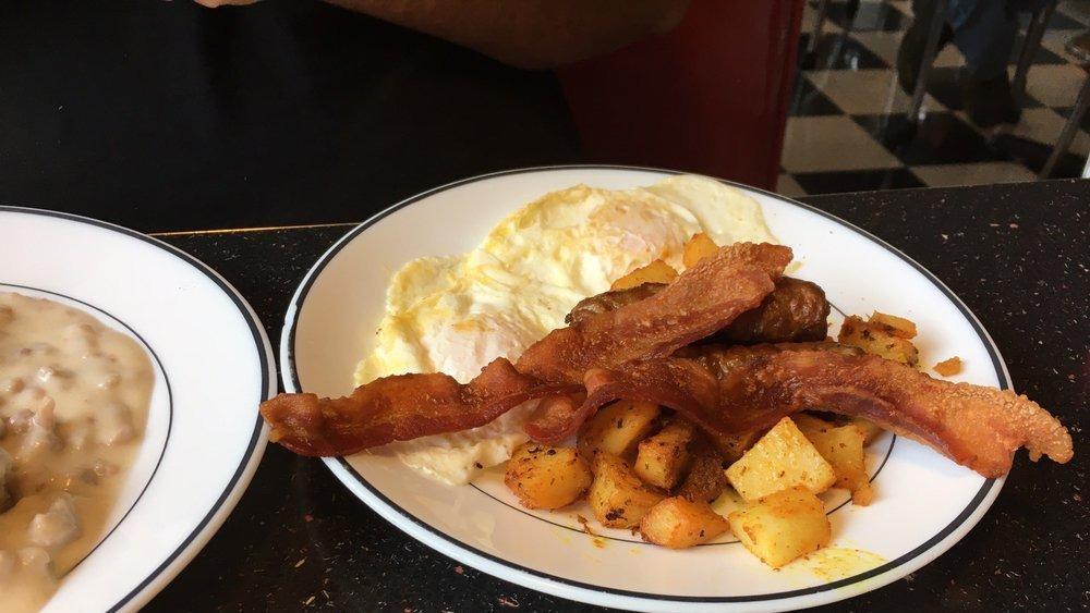 Big Dog · Eggs, two bacon slices, two sausages, two biscuits with gravy home fries.