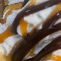 Churro Sunday · Vanilla Ice Cream, churro, whipped cream, caramel, and chocolate sauce