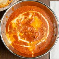 Butter Chicken · Fresh chicken cooked in our special butter sauce and served with naan.