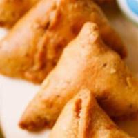Koyla Vegetable Samosa (2 Pieces) · Fried pastry stuffed with green peas, potatoes, onions, and spices.