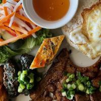 Com Mekong (Sườn Heo, Bò Lá Lốt, Chạo Tôm, Chá, Trứng) · Broken rice Mekong: grilled pork chop, grilled beef in betel leaves, shrimp wrapped sugar ca...
