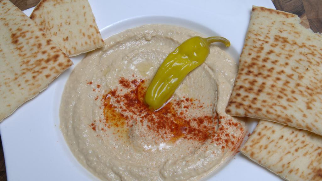 Hummus · With pita bread.