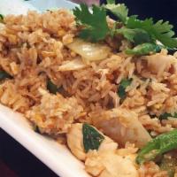 Pineapple Fried Rice · Stir-fried jasmine rice with curry powder, onion, pineapple, pea, and carrot, cashew nut, to...