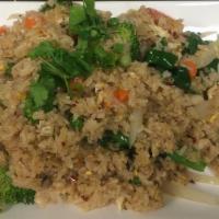 Thai Fried Rice · Stir-fried Thai jasmine rice with onion, broccoli, pea, and carrot, tomato, and egg.