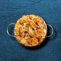 United Chicken Biryani · Succulent chunks of chicken cooked with our signature biryani masala gravy and long grain pr...