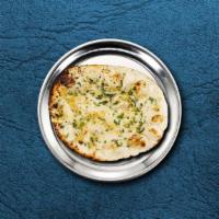 Garlic Naan Bread · House-made pulled and leavened dough pressed with finely chopped garlic and baked to perfect...
