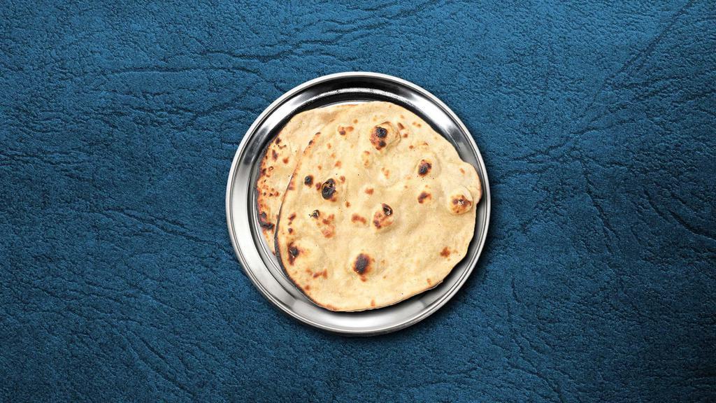 Roti · Whole wheat flat bread baked to perfection in an Indian clay oven.