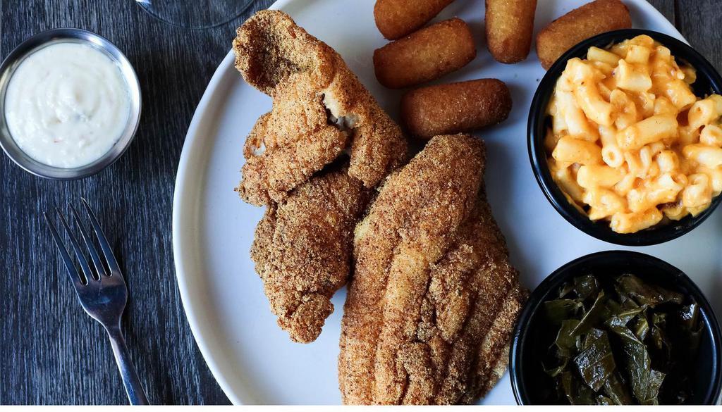 Delta Catfish Platter · Two fillets, hand-breaded & crispy-fried, a side of tartar sauce and two Southern Sides.