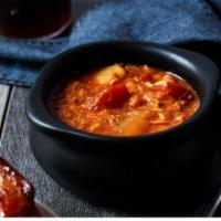 Brunswick Stew · A slow-cooked Southern classic with our pulled pork, pulled chicken, Texas brisket, potatoes...