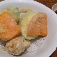 Vegetable Tempura · Vegetarian. Japanese classic deep-fried dish with a light delicious tempura batter accompani...