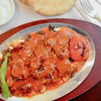 Iskender Kebab · Gluten free. Thinly sliced homemade lamb and veal doner kebab served with chopped pita bread...