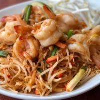 Pad Thai · Thin rice noodles stir-fried with egg, bean sprouts, scallion, ground peanut, red tofu and c...