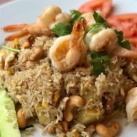Pineapple Fried Rice · Jasmine rice stir-fried with onion, scallion, pineapple, cashew, raisin, egg, and choice of ...