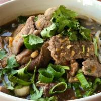 Floating Market Noodle Soup · Slices of beef, meatballs, Chinese broccoli and bean sprouts in spicy broth with thin rice n...