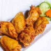 Garlic Chicken Wings (5-6 Pcs) / Cánh Gà Chiên Nước Mắm · Crispy chicken wings in caramelized fish sauce and fried garlic (5-6 pieces)