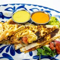 Quesadilla Pollo · grilled flour tortillas with house blend of cheeses, onions, tomatoes and side of rojo and v...