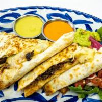Quesadilla Carne · grilled flour tortillas with house blend of cheeses, onions, tomatoes and side of rojo and v...