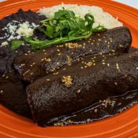 Enchiladas Mole · pulled roasted adobo chicken breast, caramelized onions, cilantro, roasted poblanos, montere...