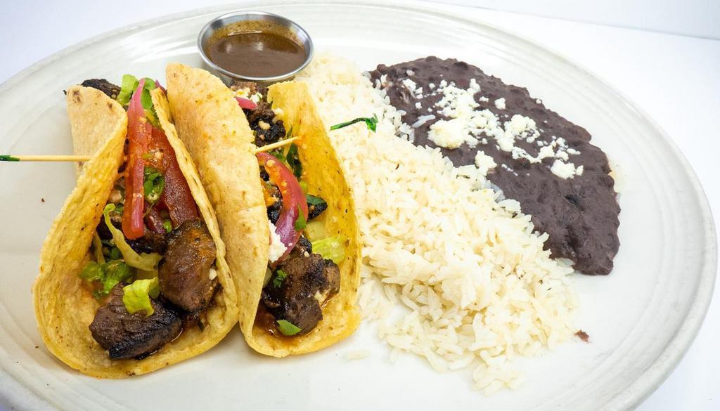 Carnitas Tacos · pork carnitas, pickled red onions, chile de arbol salsa, queso fresco, cilantro, housemade soft white corn torillas, white rice, black beans 2 tacos per order served with habanero sauce on the side