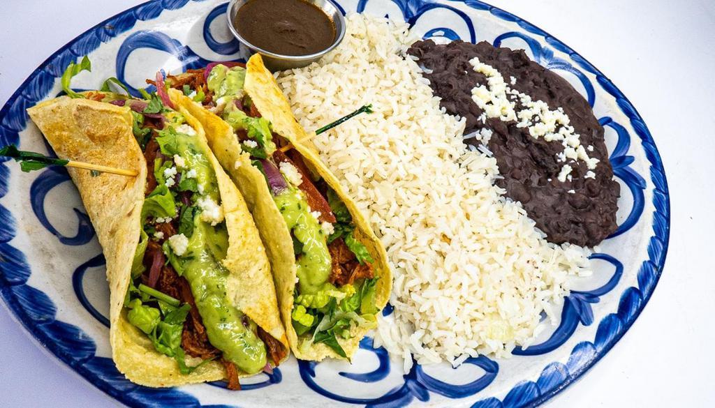 Brisket Tacos · adobo marinated brisket, romaine lettuce, tomatoes, avocado tomatillo sauce, pickled red onions, queso fresco, cilantro, housemade soft white corn torillas, white rice, black beans 2 tacos per order served with habanero sauce on the side