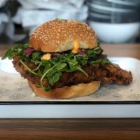 Fried Chicken Sandwich · Pickled red onions, arugula, spicy aioli, toasted sesame bun with camp fries