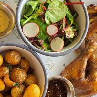 Rotisserie Organic Half Chicken · Smashed Yukon golds and arugula salad, charred onion aioli, and espresso BBQ sauces