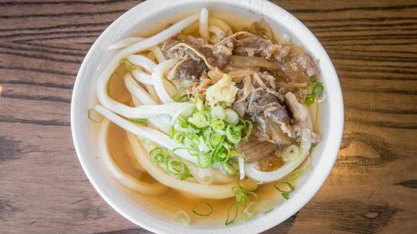 Niku Soup · Hand-made udon noodles served in our signature dashi broth and topped with savory sukiyaki beef and onions. Our most popular dish!