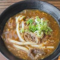 Curry Soup · Hand-made udon noodles served in our signature beef curry soup (thicker stew with beef cooke...