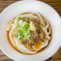 Niku Sauce · Hand-made udon noodles lightly dressed with our signature dashi soy sauce and topped with sa...